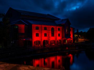 External image of Theatr Brycheiniog lit up in red