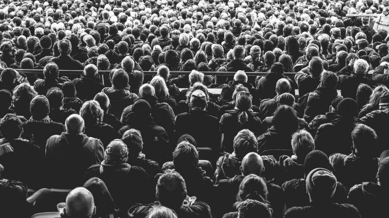 Black and white photo of an audience